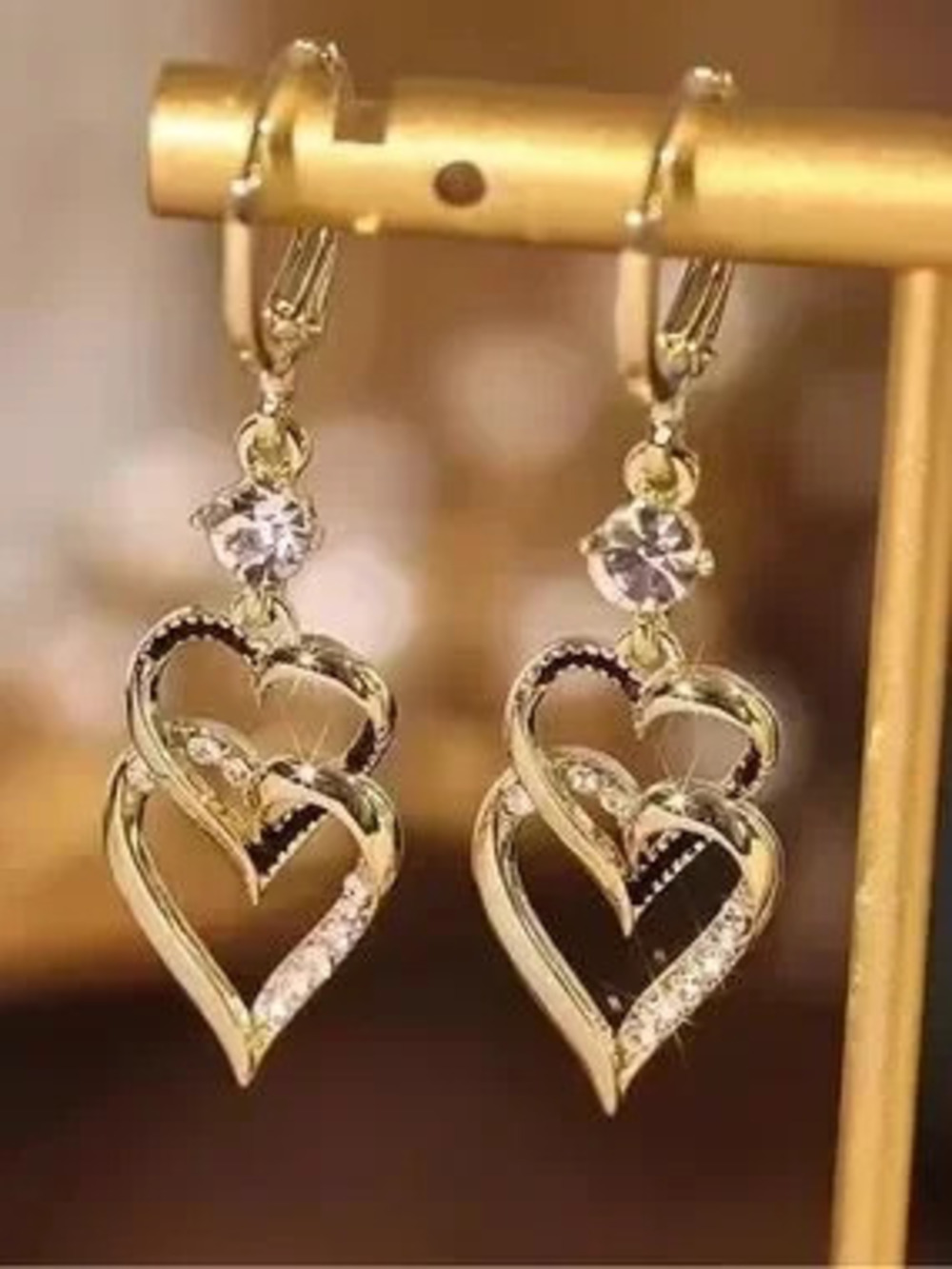 Anthropologie Gold Tone Heart Dangle Earrings with Clear Stones